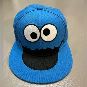 Sesame Street Cookie Monster Flat Bill Fitted Hat L/XL Blue Cookie Pattern Brim